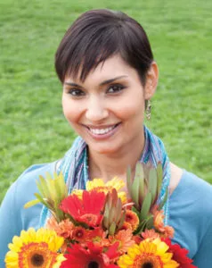 Woman smiling holding flowers